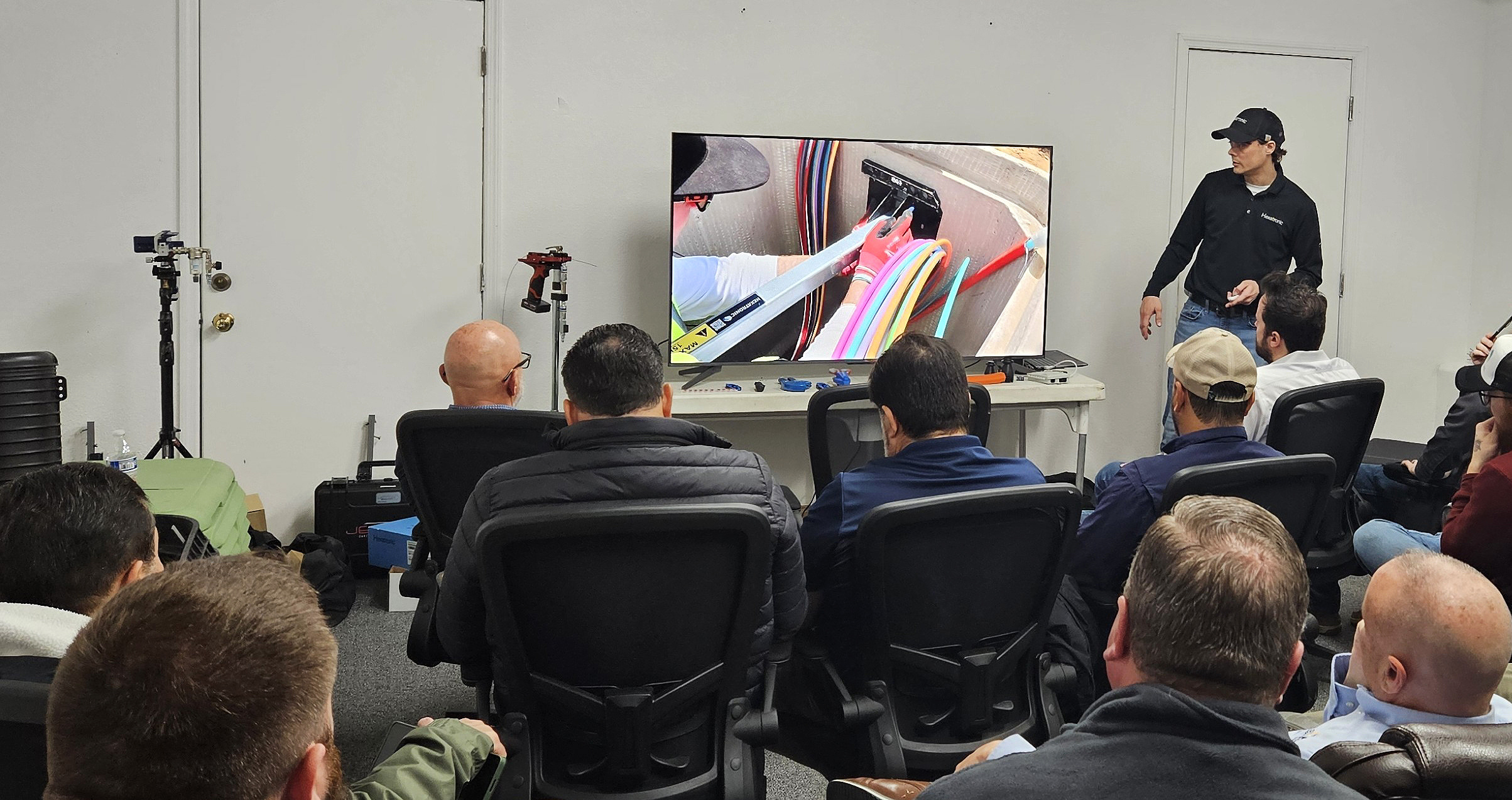 Fiber training session in a classroom setting with several participants.